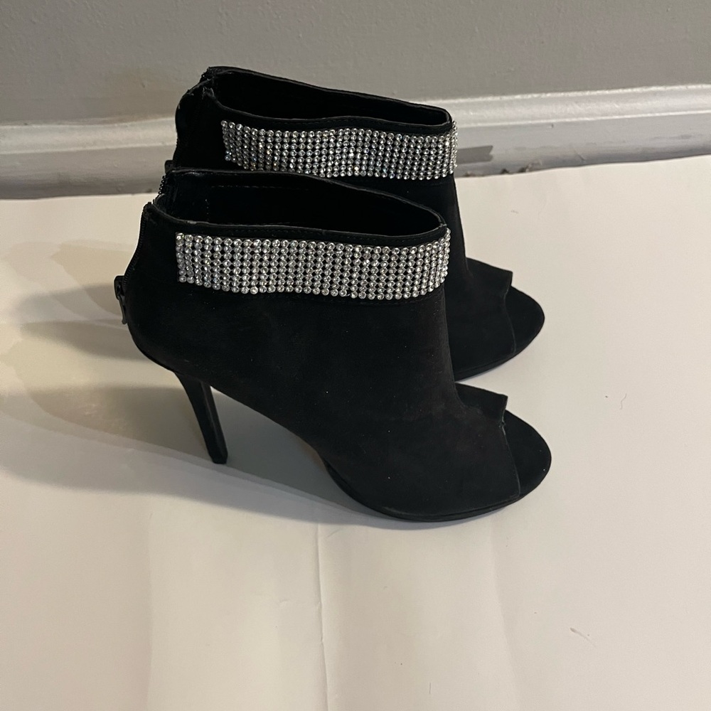 Elegant Black Peep-Toe Heels with Rhinestone Detail.